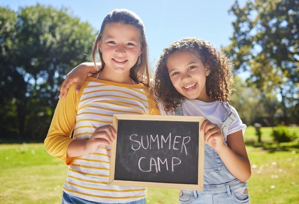 two girl kids enjoying benefit of summer camp
