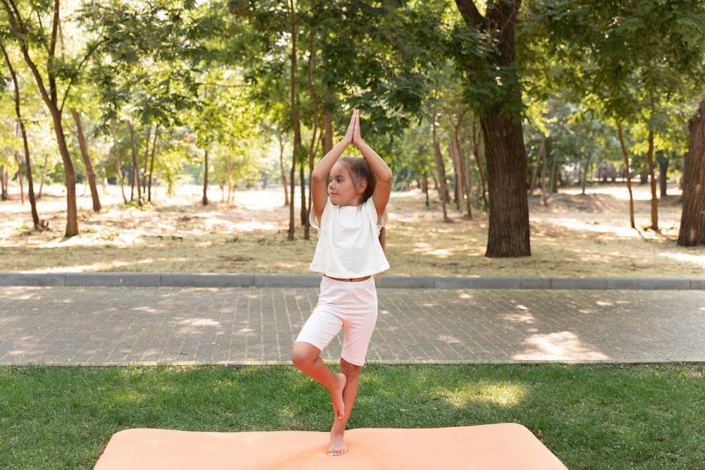 Small kid doing Yoga for Health benefits